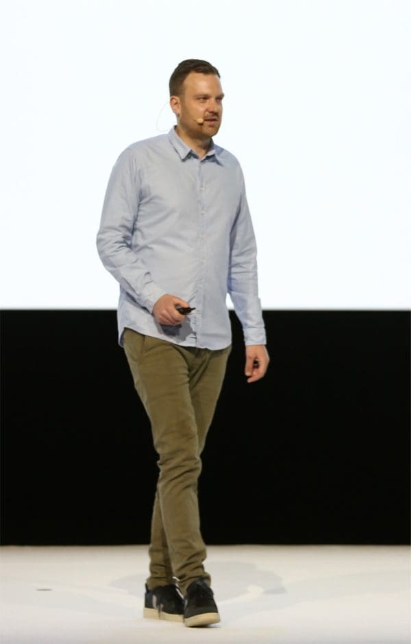 Wiebe Wakker on stage giving a talk